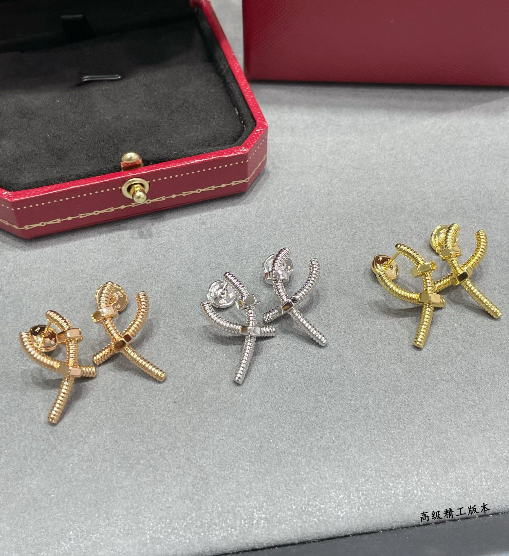 Ca*t*er cross screw earrings